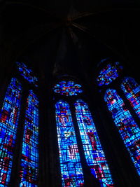Low angle view of illuminated church ceiling