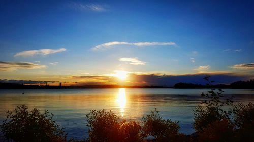 Scenic view of lake at sunset