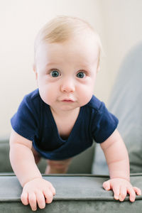 Baby staring ointo camera with wide eyes