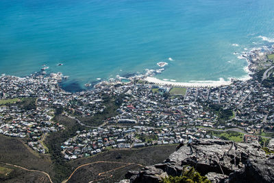 High angle view of sea and buildings in city