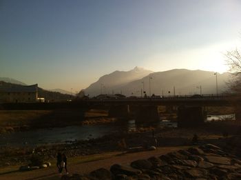 Scenic view of mountains against clear sky during sunset
