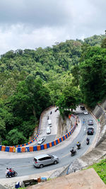 High angle view of road by trees against sky