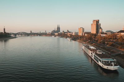 High angle view of river and buildings against sky