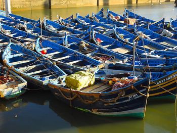 High angle view of fishing boats moored at harbor