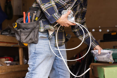 Rear view of woman using mobile phone