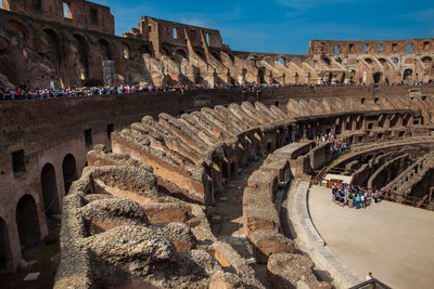 View of the interior of the roman colosseum showing the arena and the hypogeum in a sunny day