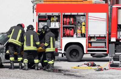 People working on street in city