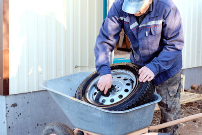 70 year old auto mechanic at work. retired at work.