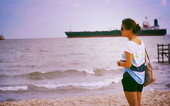 lifestyles, leisure activity, sea, water, beach, standing, casual clothing, rear view, shore, full length, three quarter length, sky, vacations, childhood, horizon over water, person, girls