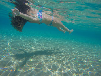 Full length of woman swimming in sea