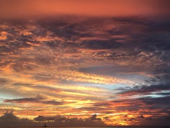 Low angle view of dramatic sky during sunset