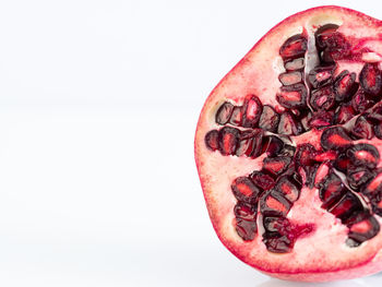 Close-up of strawberry over white background