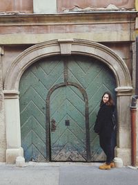 Woman standing in front of building