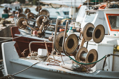 Close-up of sailboats moored at harbor