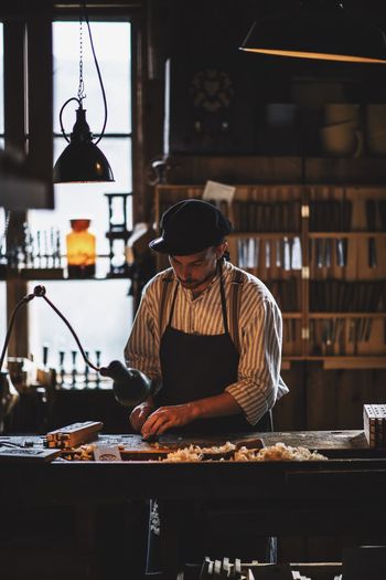 Man working on table at workshop