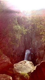 Close-up of landscape against sky during sunset