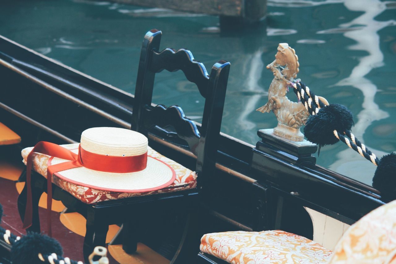 table, no people, chair, day, figurine, outdoors, close-up, animal themes, flower, bird