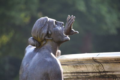 Close-up of angel statue in park