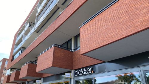 Low angle view of modern building against sky