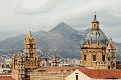 Cathedral in city against sky 