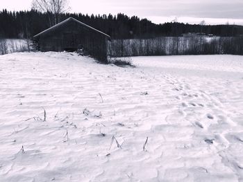 Scenic view of landscape against sky during winter