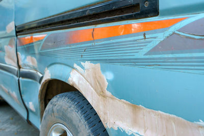 Close-up of damaged bus outdoors