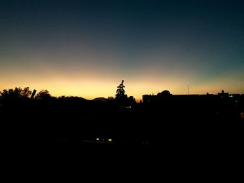 Silhouette of buildings at sunset