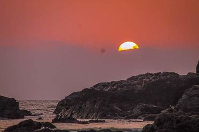 Scenic view of sea at sunset