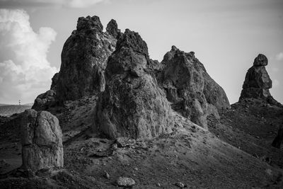 Low angle view of rock formations against sky