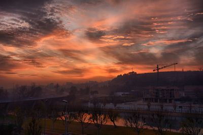 Scenic view of townscape against sky during sunset