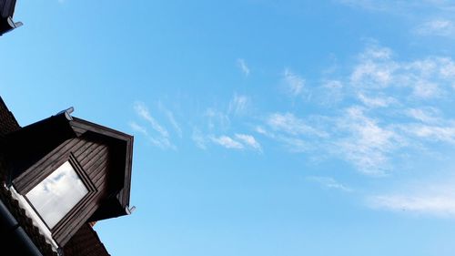 Low angle view of house against blue sky