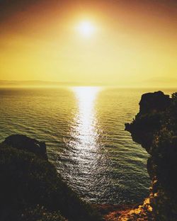 Scenic view of sea against sky at sunset