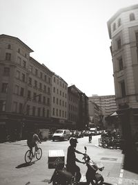 People riding bicycle on city street