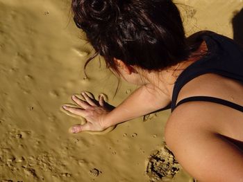 Rear view of woman standing on beach