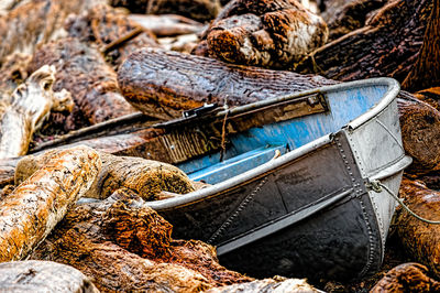 Boats moored by logs