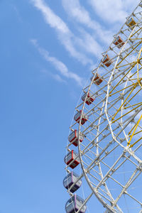 Big ferris with cabins wheel against deep blue sky. part of of giant wheel in amusement park