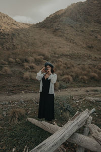 Full length of woman standing on field