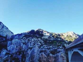 Scenic view of mountains against clear blue sky