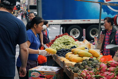 People at market stall