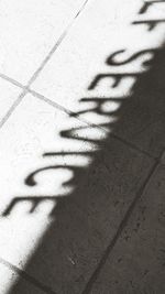 Close-up of shadow on sand