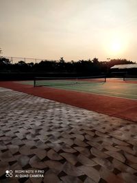 View of empty park against sky during sunset