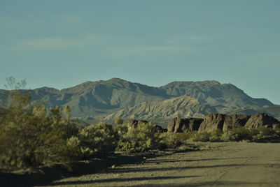 Scenic view of landscape and mountains against sky