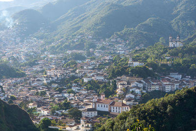 High angle view of townscape and mountains