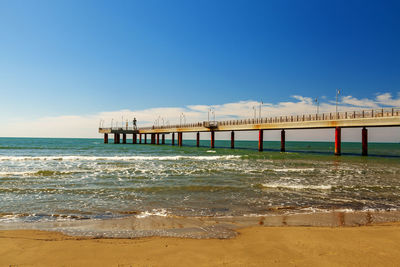 Pier over sea against sky