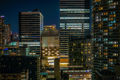 Illuminated buildings in city at night