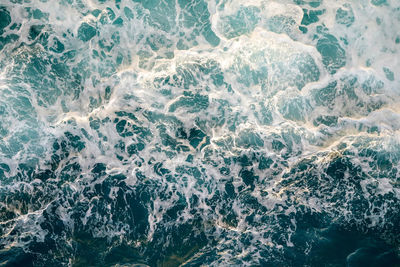 High angle view of water splashing in sea