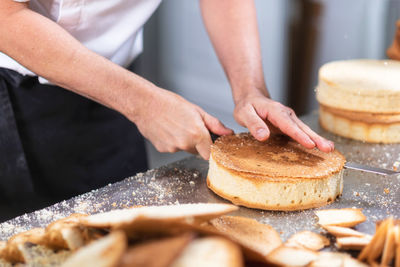 Midsection of man preparing food