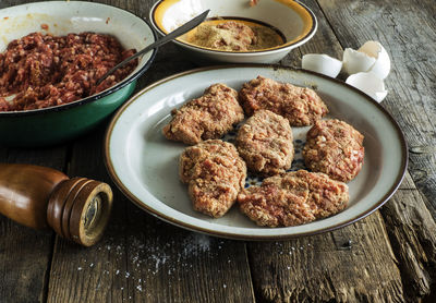 High angle view of minced meat preparation at table