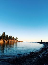 Scenic view of calm sea against clear sky