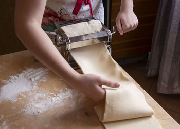 Low section of man washing hands